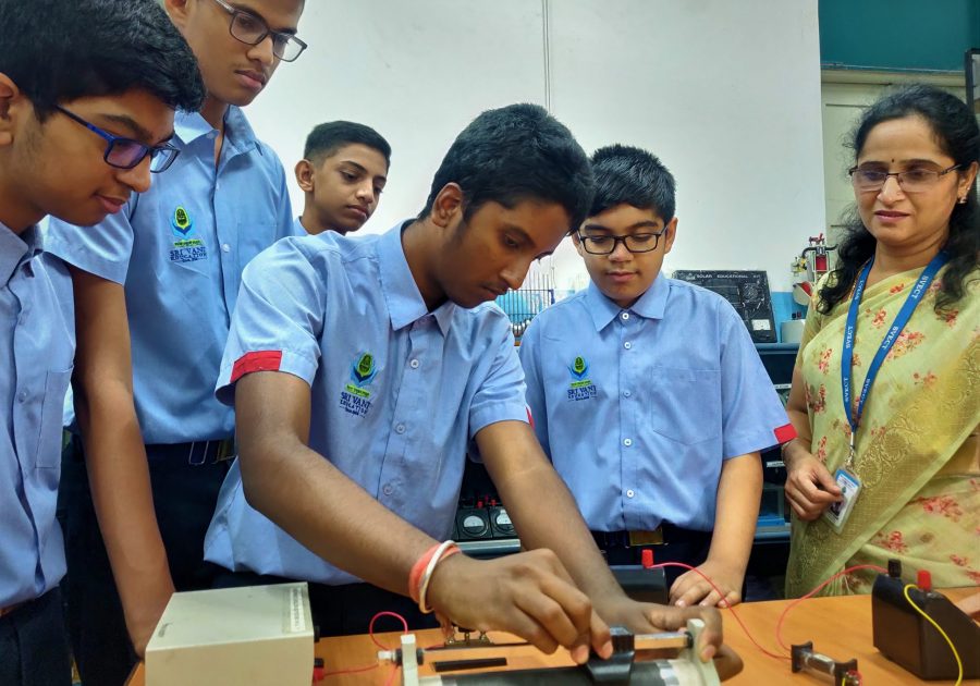 Indian school students performing physics experiment