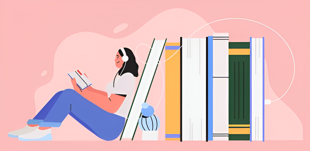Girl sitting next to a pile of books