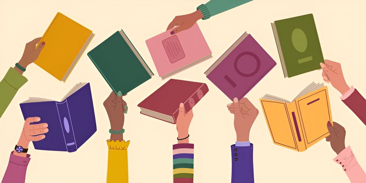 Children holding up books
