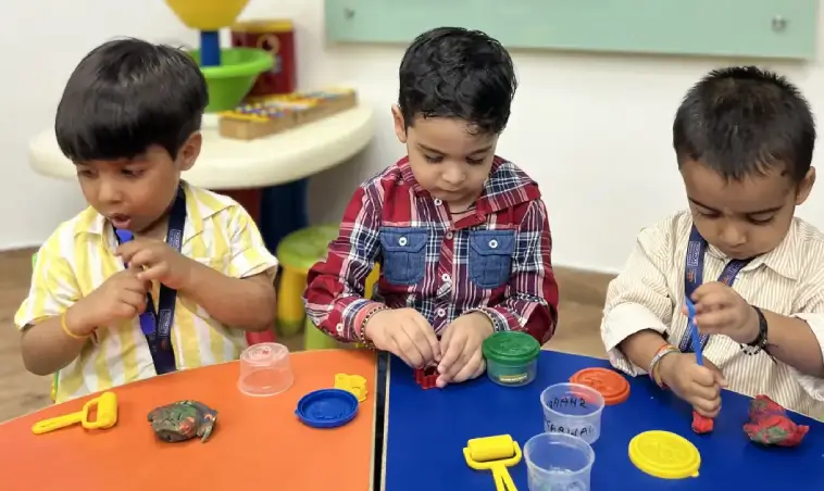 Children learning through play dough