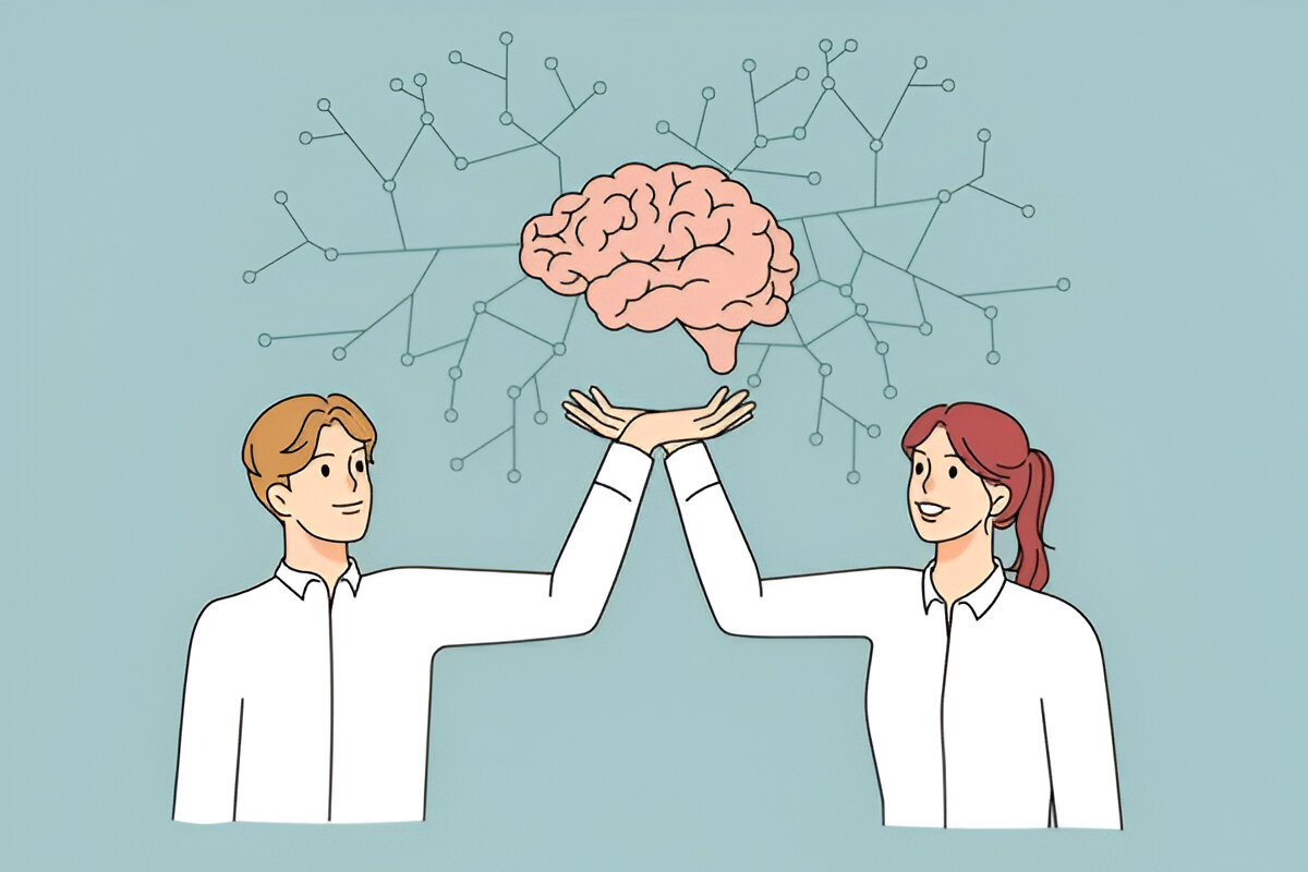 Two students showcasing a brain